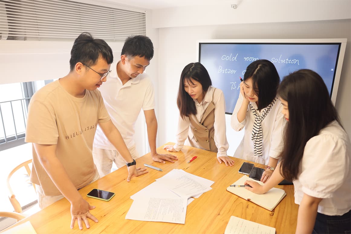 The sales are discussing the customer's cold storage solutions